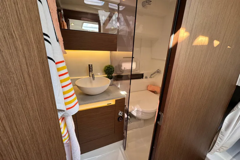  Yacht Photos Pics Luxurious bathroom in 2025 Jeanneau Leader 10.5 WA Series 2 yacht, featuring modern fixtures.