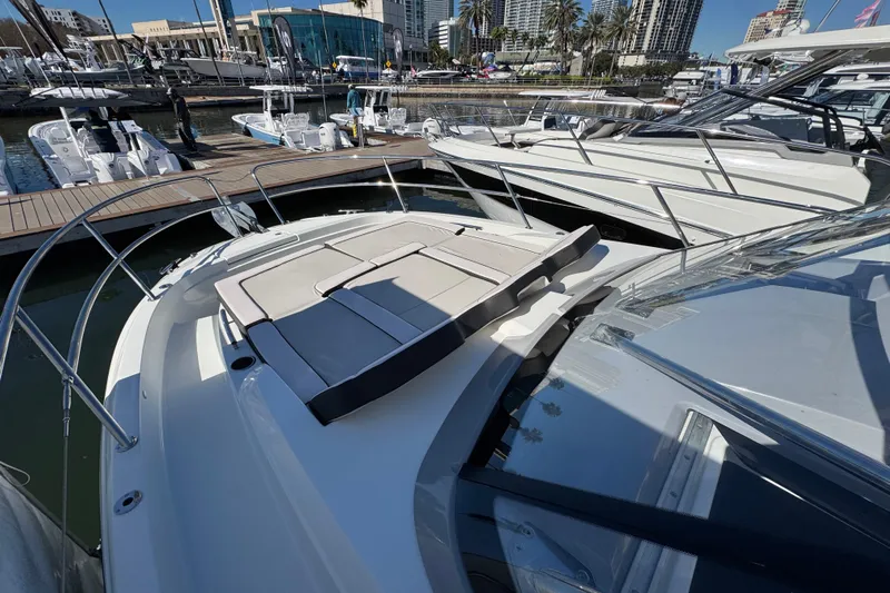  Yacht Photos Pics 2025 Jeanneau Leader 10.5 WA Series 2 yacht docked at marina, featuring spacious sunbathing area.