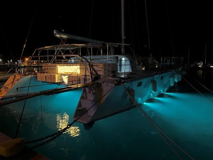 Ps 70 Yacht Photos Pics Sailboat "BLUE PEGASUS 70" by Shuttleworth, illuminated at night, docked in marina, 1990 model.