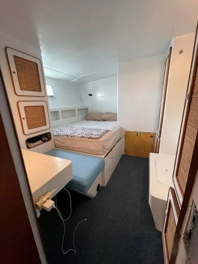 Ps 70 Yacht Photos Pics Cozy cabin interior of 1990 Shuttleworth BLUE PEGASUS 70 with bed and storage.