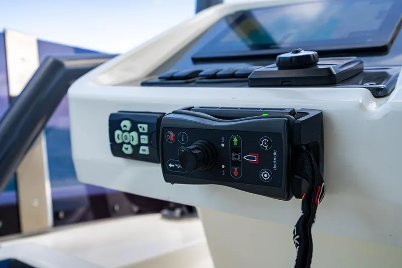 Grace Yacht Photos Pics Control panel of 2022 Beneteau Monte Carlo 52 yacht, featuring joystick and buttons.