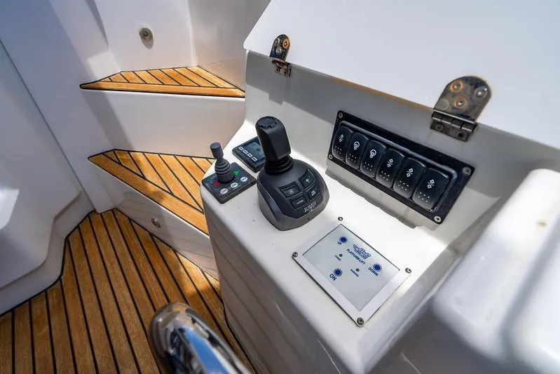 Grace Yacht Photos Pics Control panel of 2022 Beneteau Monte Carlo 52 yacht with joystick and switches.