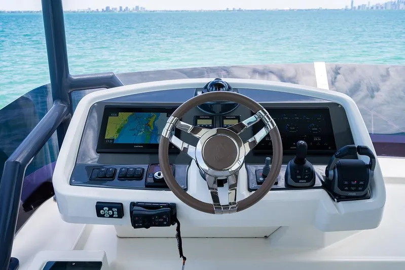 Grace Yacht Photos Pics Helm of 2022 Beneteau Monte Carlo 52 yacht with navigation screens and controls.