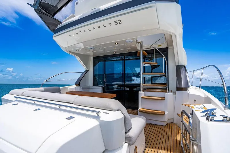 Grace Yacht Photos Pics Luxury Beneteau Monte Carlo 52 yacht, 2022 model, with elegant deck and ocean view.