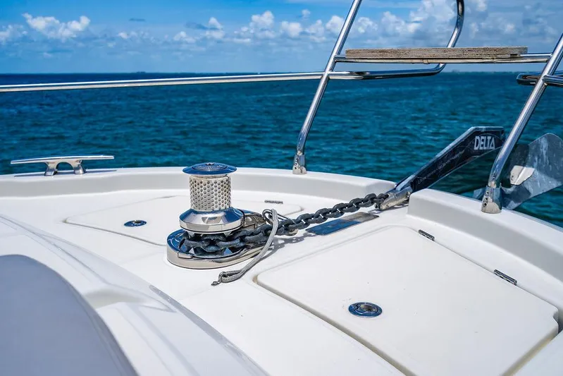 Grace Yacht Photos Pics Bow of 2022 Beneteau Monte Carlo 52 yacht with anchor chain, ocean view.