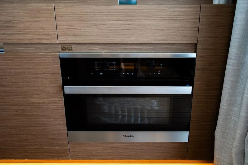 Grace Yacht Photos Pics Built-in Miele oven in 2022 Beneteau Monte Carlo 52 yacht kitchen.
