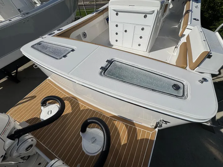  Yacht Photos Pics 2025 Regulator 31 boat interior with storage compartments and seating.