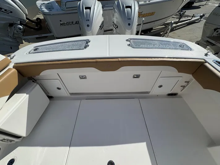 Yacht Photos Pics 2025 Regulator 31 boat interior with storage compartments and twin engines.