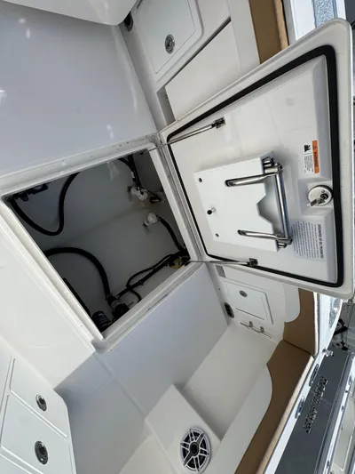  Yacht Photos Pics Open storage compartment on a 2025 Regulator 31 boat, showing interior details and components.