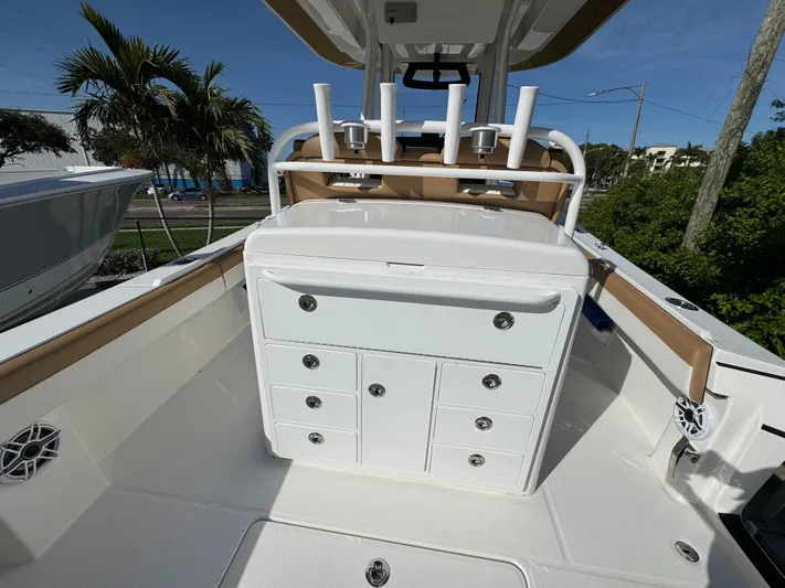  Yacht Photos Pics 2025 Regulator 31 boat interior with storage compartments and rod holders.