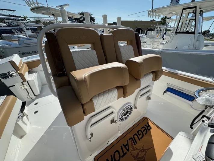  Yacht Photos Pics 2025 Regulator 31 boat interior with tan and white seating, showcasing luxury and comfort.