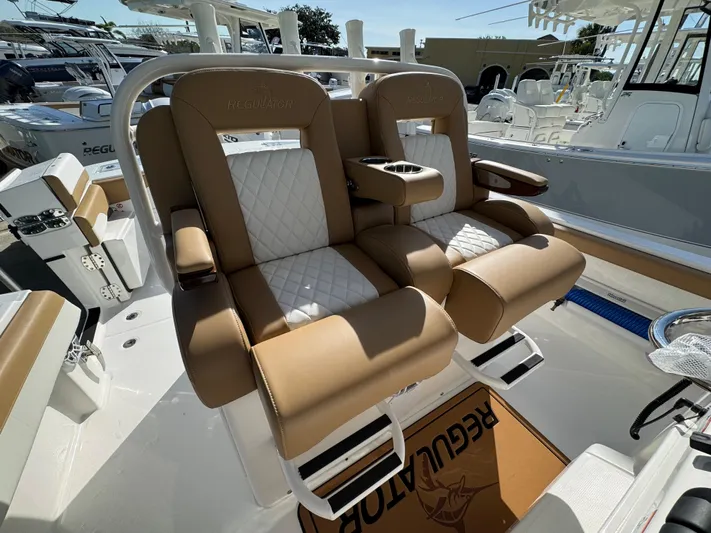  Yacht Photos Pics 2025 Regulator 31 boat with luxurious tan and white seating.