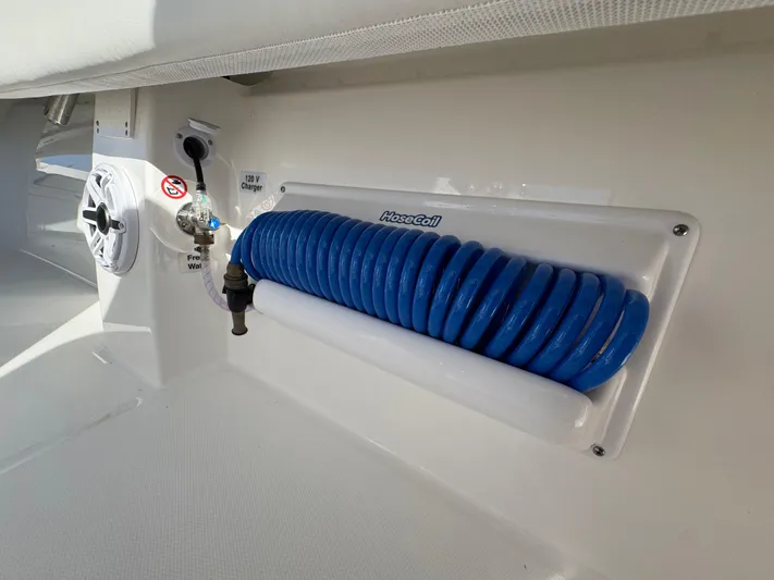  Yacht Photos Pics 2025 Regulator 31 boat with blue HoseCoil and 120V charger.