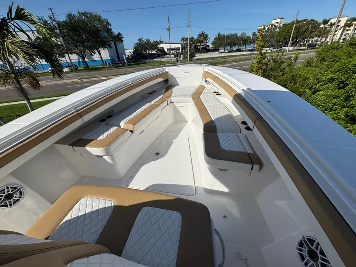  Yacht Photos Pics 2025 Regulator 31 boat interior with tan and white seating, showcasing spacious design.