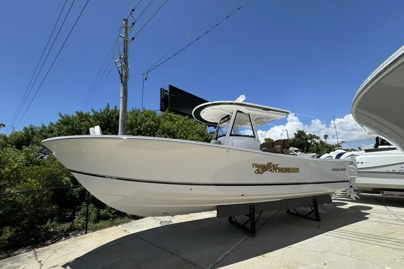  Yacht Photos Pics 2025 Regulator 31 boat on display under clear blue sky.