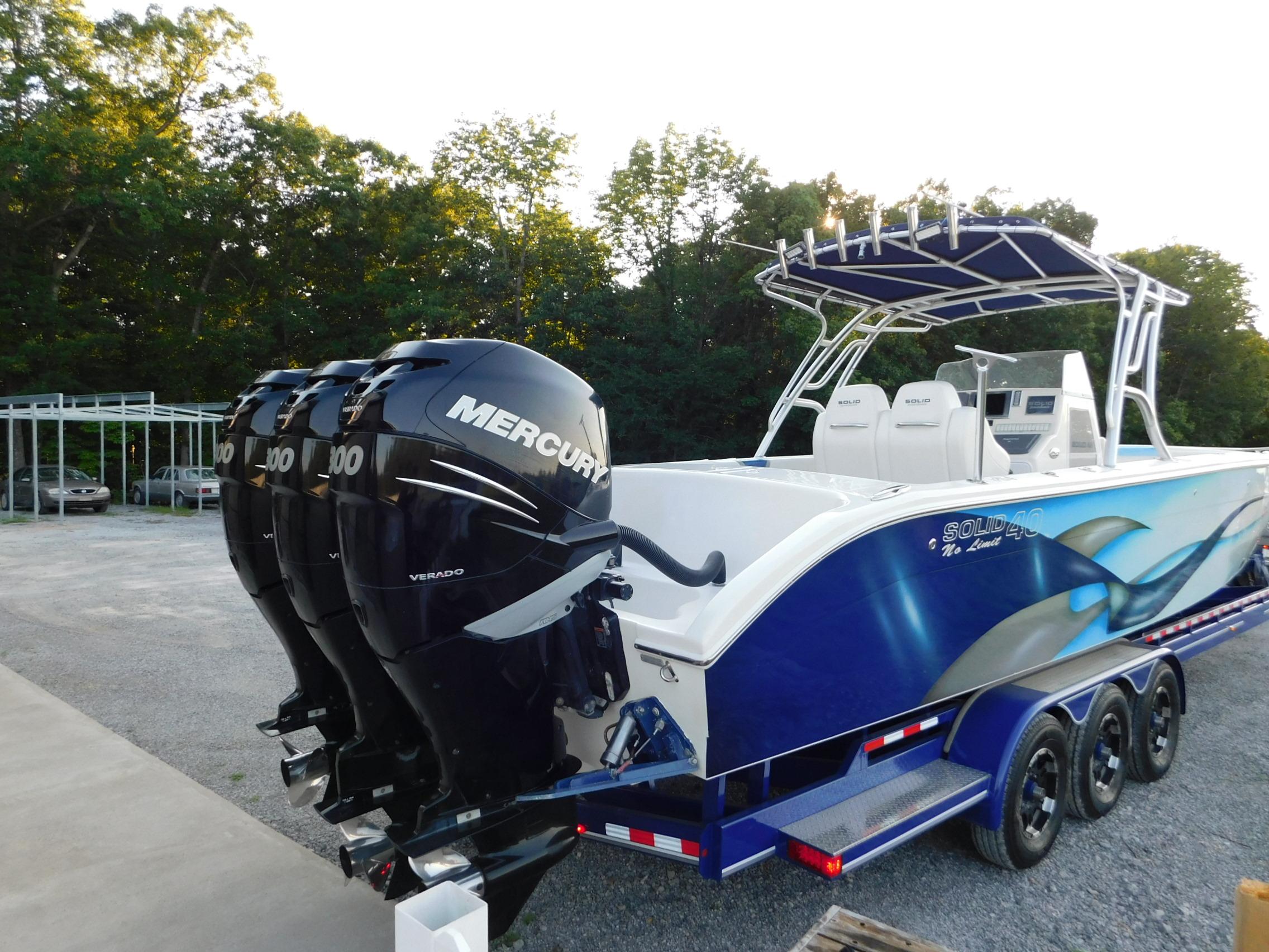 2005 Solid Craft LIMITED 40 boat with triple Mercury outboard engines on a trailer.