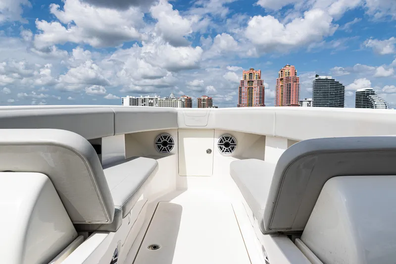  Yacht Photos Pics 2022 SeaVee 370z boat interior with city skyline and cloudy sky background.