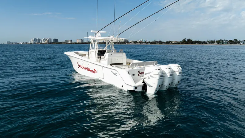  Yacht Photos Pics 2022 SeaVee 370z boat with triple engines on open water.