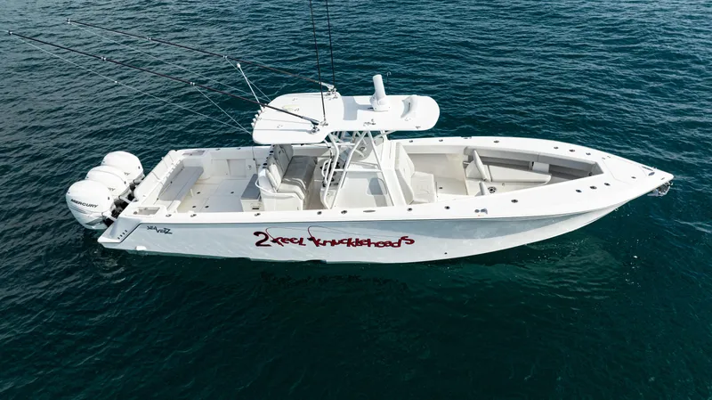  Yacht Photos Pics 2022 SeaVee 370z boat on open water, featuring triple outboard engines.