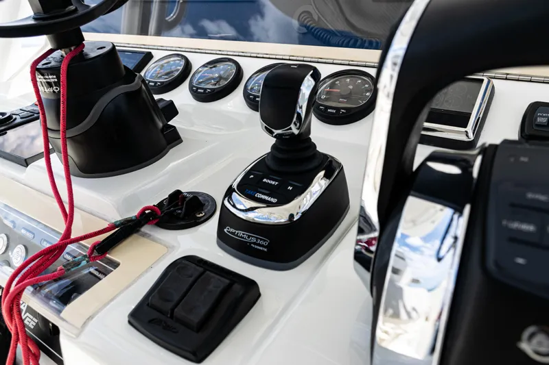  Yacht Photos Pics Control panel of a 2022 SeaVee 370z boat with joystick and gauges.