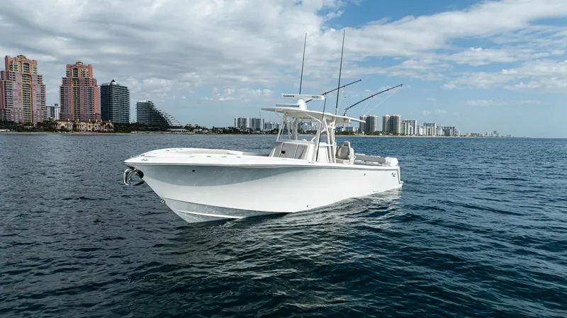  Yacht Photos Pics 2022 SeaVee 370z boat on ocean with city skyline in background.