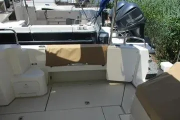  Yacht Photos Pics 2021 Ranger Tugs R-31 CB boat deck with seating and outboard motor.