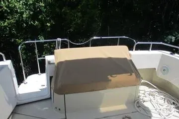  Yacht Photos Pics 2021 Ranger Tugs R-31 CB boat deck with railing and covered seating area.