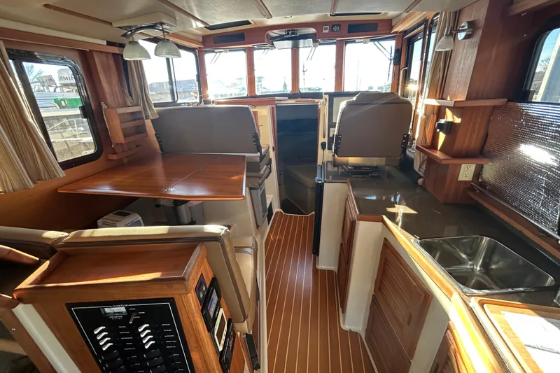  Yacht Photos Pics Interior of 2021 Ranger Tugs R-31 CB, featuring wood finishes and modern amenities.