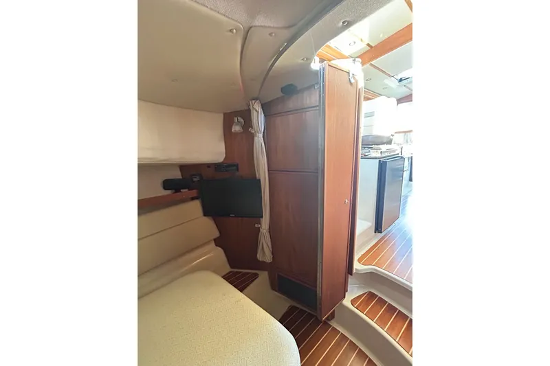  Yacht Photos Pics Interior of 2021 Ranger Tugs R-31 CB, featuring wood paneling and compact living space.