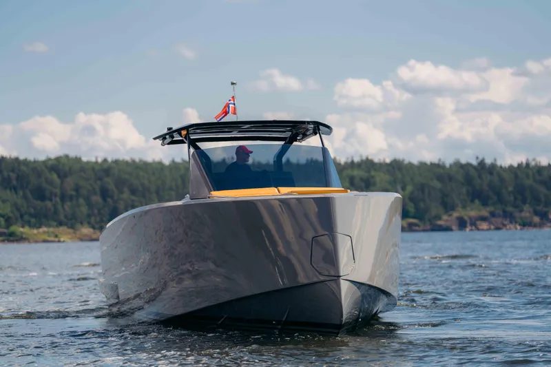 Delilah Yacht Photos Pics 2024 Pardo Yachts 43 cruising on a scenic lake with forested shoreline.