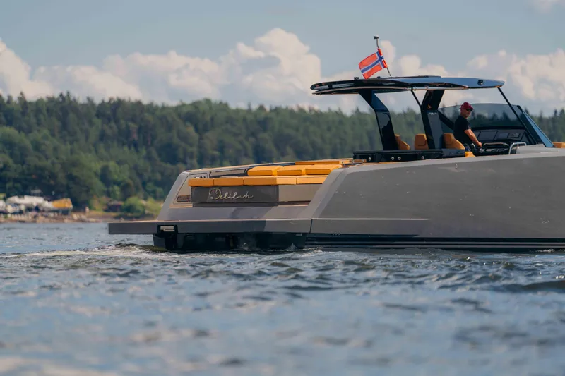 Delilah Yacht Photos Pics 2024 Pardo Yachts 43 cruising on a scenic lake with forested shoreline.