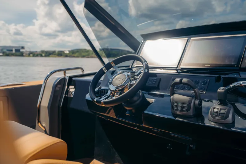 Delilah Yacht Photos Pics Helm of 2024 Pardo Yachts 43 with modern controls and scenic water view.