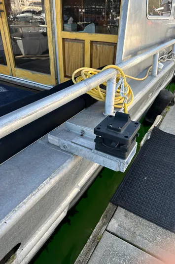 Lone Wolf Yacht Photos Pics 2002 Custom Carlson Marine Trawler docked, showing railing and electrical setup.