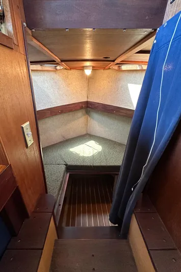 Lone Wolf Yacht Photos Pics Interior of 2002 Carlson Marine Trawler with cozy cabin and wooden accents.