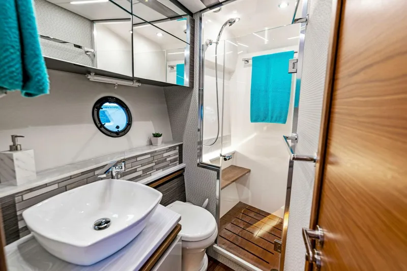 Victory Yacht Photos Pics Modern bathroom in 2019 Tiara Yachts 49 COUPE with vessel sink and glass shower.