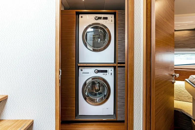Victory Yacht Photos Pics Stacked washer and dryer in 2019 Tiara Yachts 49 COUPE laundry area.