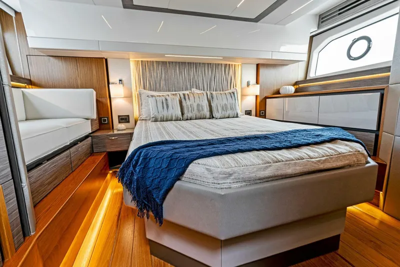 Victory Yacht Photos Pics Luxurious bedroom interior of 2019 Tiara Yachts 49 COUPE with modern design and ambient lighting.