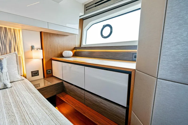 Victory Yacht Photos Pics Luxurious interior of 2019 Tiara Yachts 49 COUPE with modern cabinetry and window.