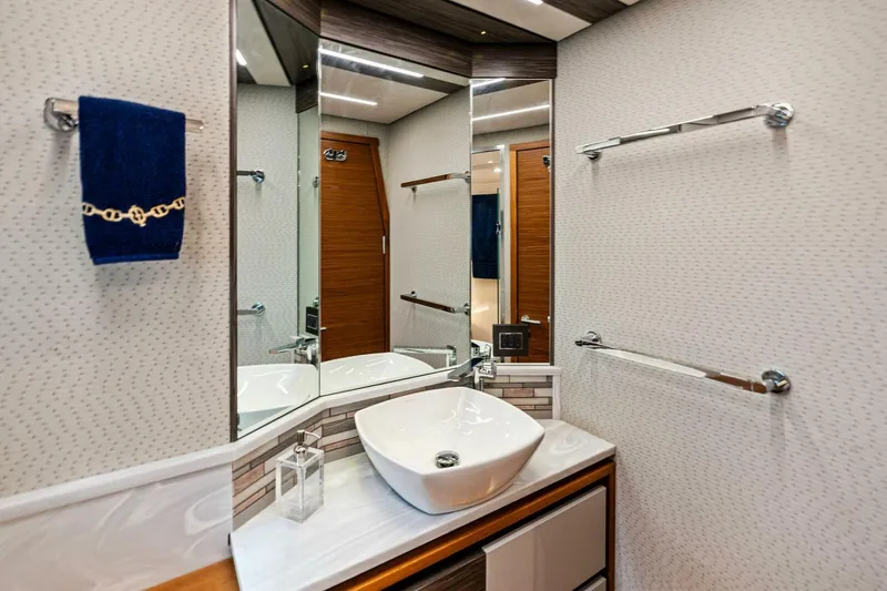 Victory Yacht Photos Pics 2019 Tiara Yachts 49 COUPE bathroom with modern sink and mirror.
