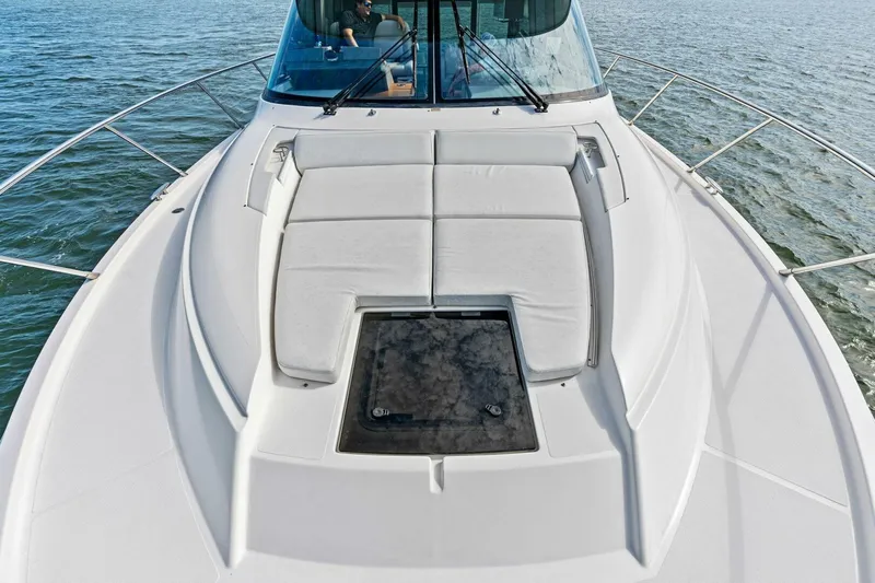 Victory Yacht Photos Pics 2019 Tiara Yachts 49 COUPE bow with sunpad and hatch on open water.