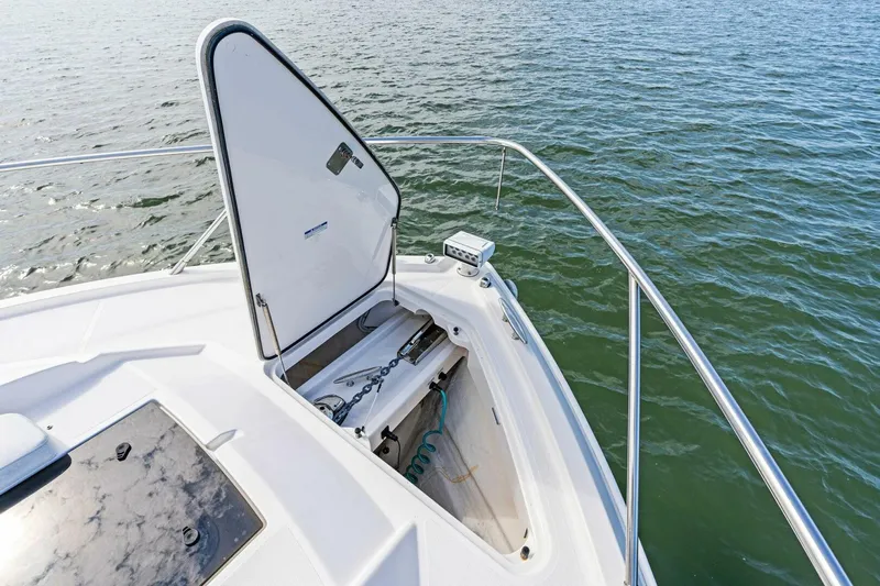 Victory Yacht Photos Pics 2019 Tiara Yachts 49 COUPE bow storage compartment open on the water.