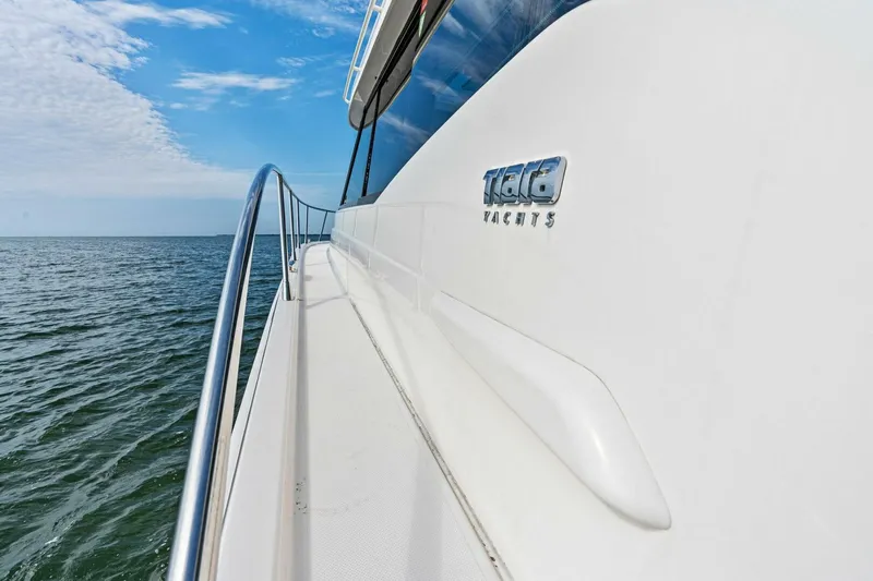 Victory Yacht Photos Pics 2019 Tiara Yachts 49 Coupe on open water, side view.