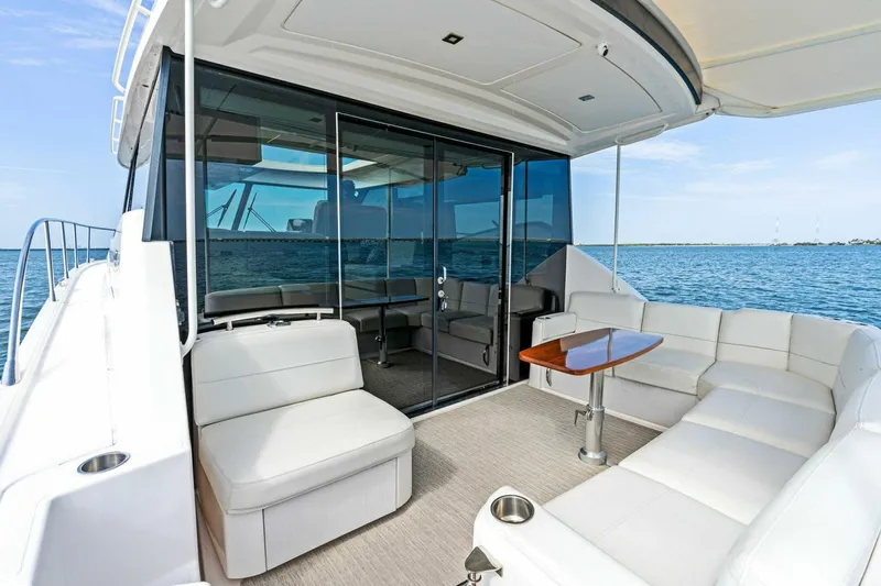 Victory Yacht Photos Pics 2019 Tiara Yachts 49 COUPE luxury yacht with spacious outdoor seating area.