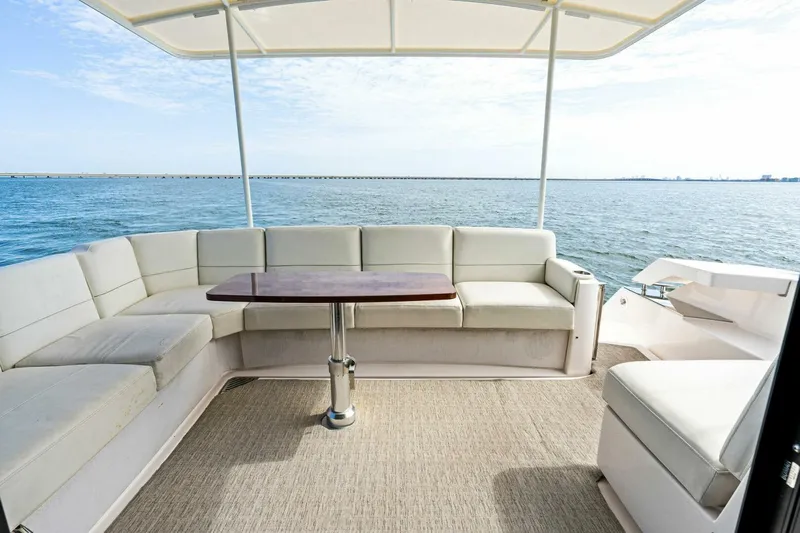 Victory Yacht Photos Pics Spacious seating area on a 2019 Tiara Yachts 49 COUPE with ocean view.