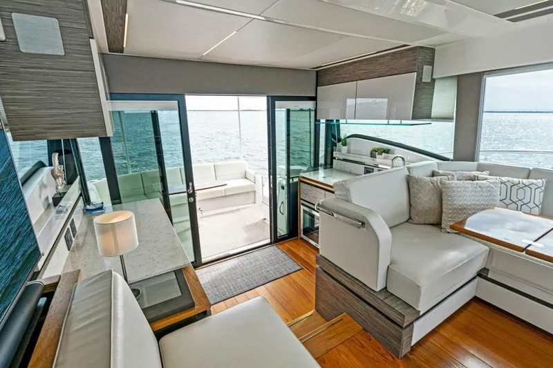 Victory Yacht Photos Pics 2019 Tiara Yachts 49 COUPE interior with modern seating and ocean view.