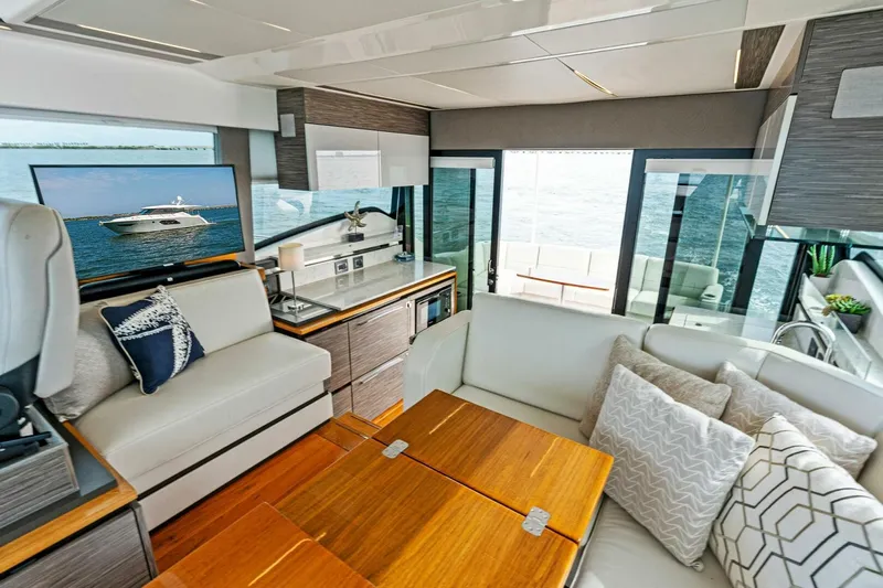 Victory Yacht Photos Pics Luxurious interior of 2019 Tiara Yachts 49 COUPE with modern furnishings and ocean view.