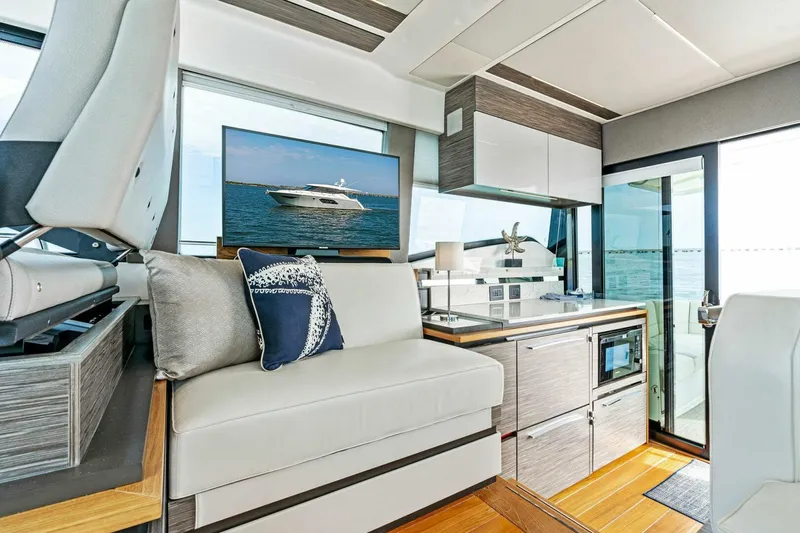 Victory Yacht Photos Pics Modern interior of 2019 Tiara Yachts 49 COUPE with sleek design and ocean view.
