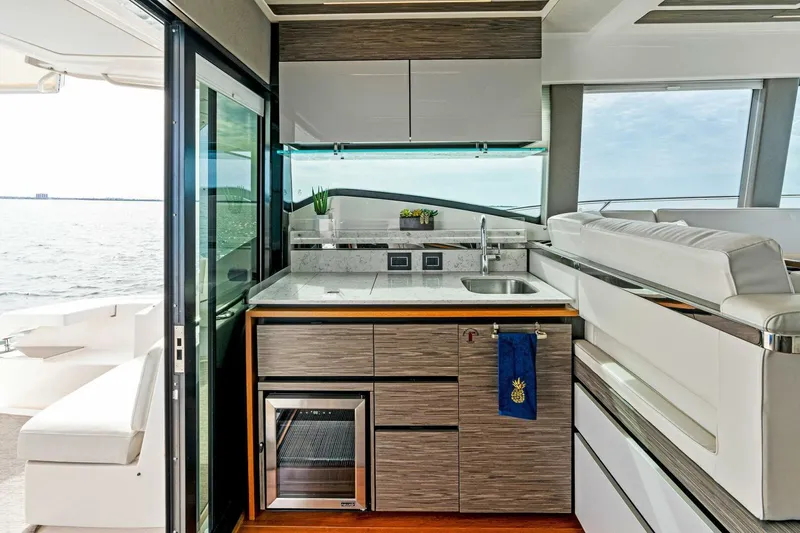Victory Yacht Photos Pics Modern kitchen area on 2019 Tiara Yachts 49 COUPE with ocean view.