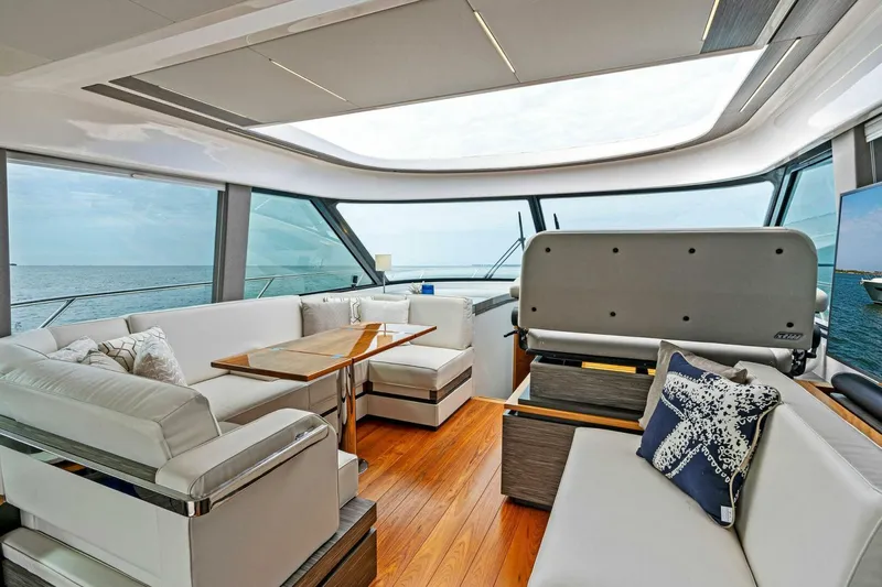 Victory Yacht Photos Pics 2019 Tiara Yachts 49 COUPE interior with luxurious seating and ocean view.