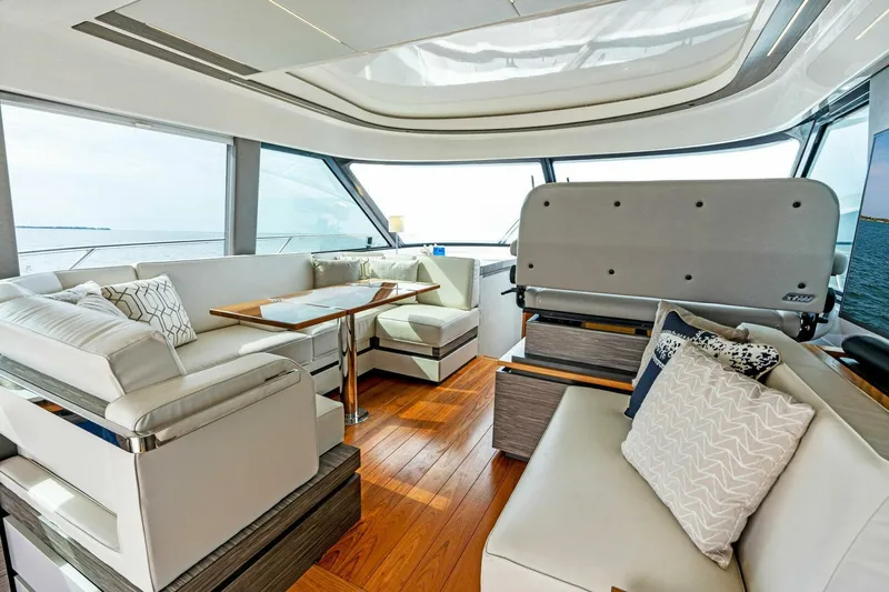 Victory Yacht Photos Pics Interior of 2019 Tiara Yachts 49 COUPE with luxurious seating and wooden flooring.
